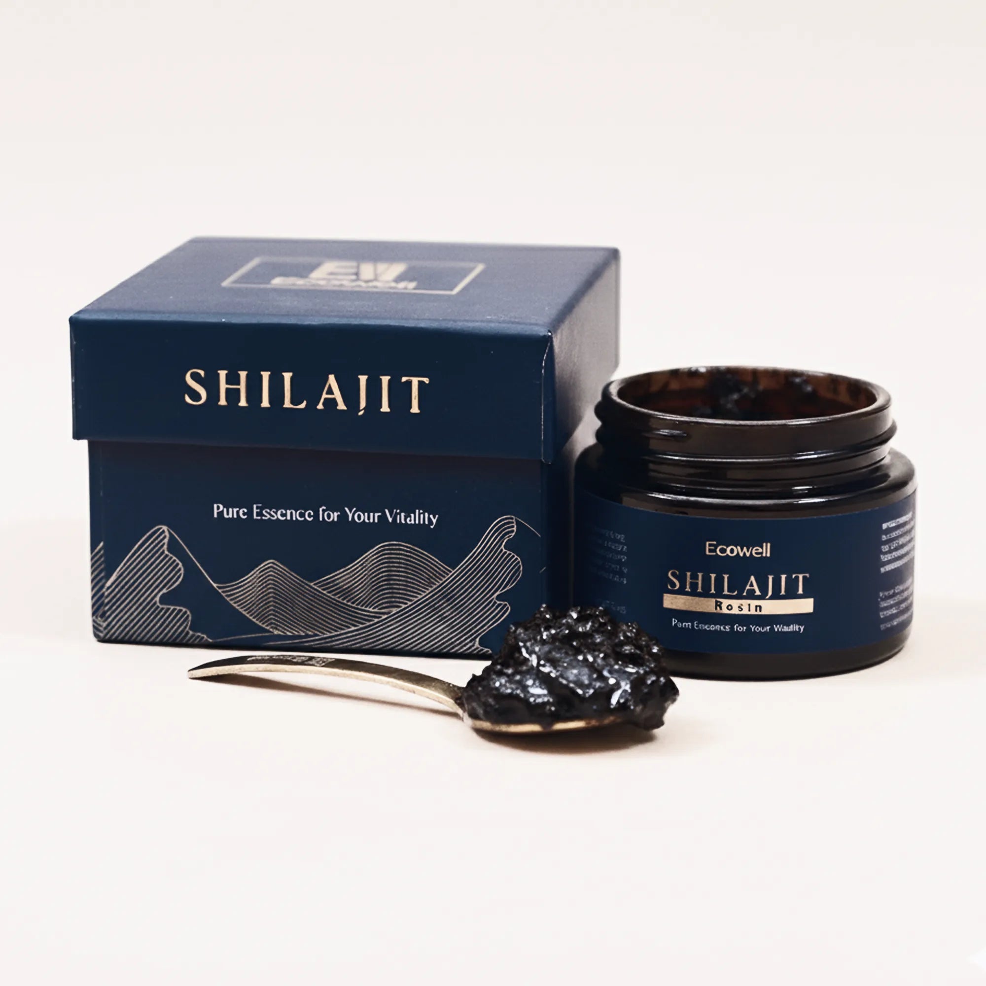 Shilajit resin with a spoonful of resin and its packaging on a white background