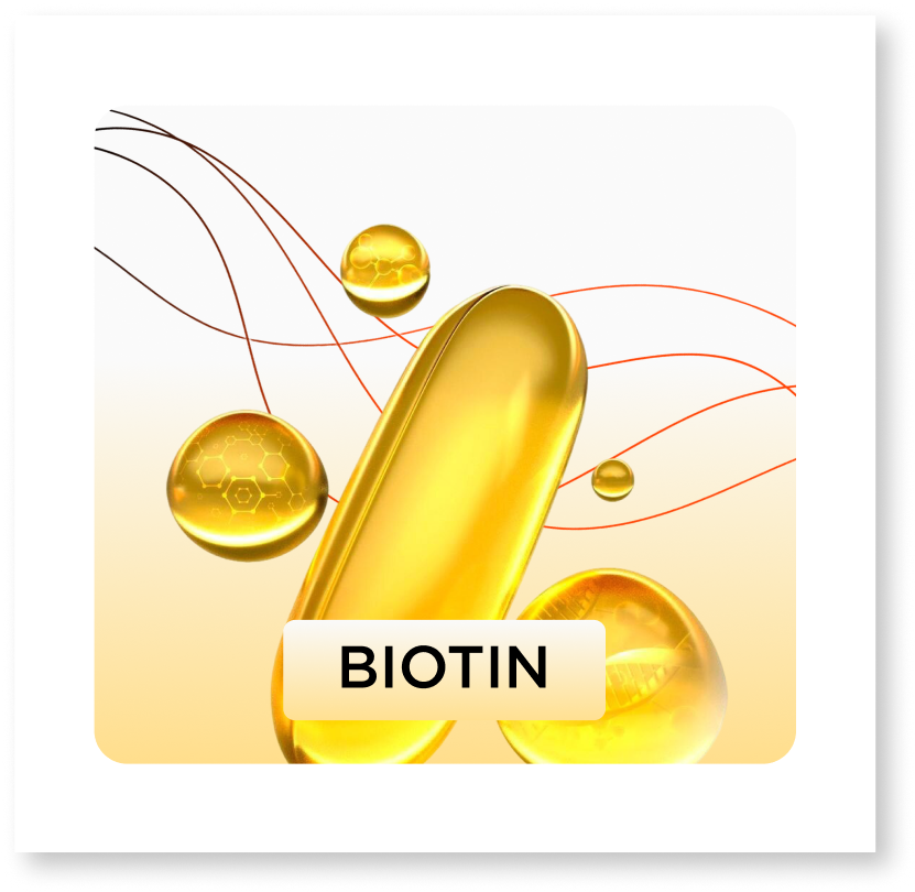 Gold biotin supplement capsule with droplets on a white background
