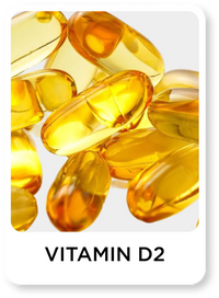 Yellow vitamin D2 capsules on a white background